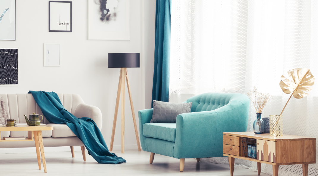 Room with blue sofa, floor lamp woth black shade. make the room irresistably attractive before selling.